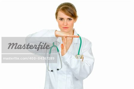 Concentrated medical doctor woman with time out crossed arms  isolated on white