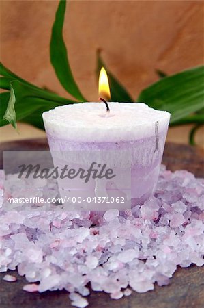 purple candle and sea salt spa concept