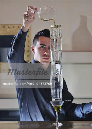 pro barman prepares cocktail drink