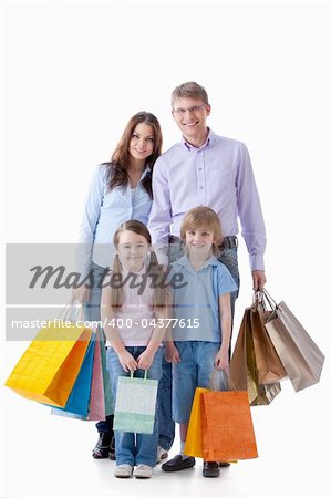 Family with shopping bags on a white background