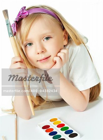 cute little girl with paints in studio