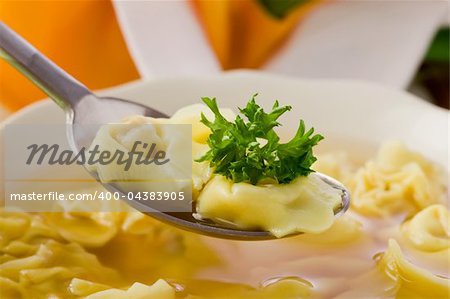 photo of delicious tortellini in bouillon