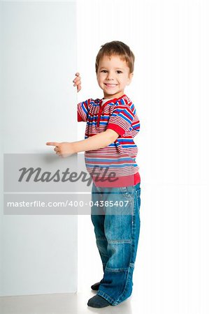 boy beside a white blank for text or image