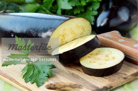 fresh ripe organic eggplants on a wooden table