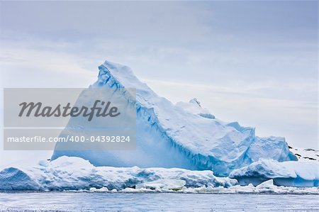 Huge iceberg in the snow in Antarctica