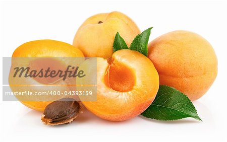 apricot fruits with green leaf and cut isolated on white background