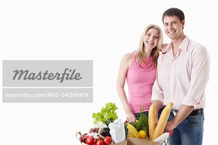The happy couple with food on a white background