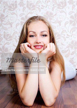 young beautiful woman on the floor of the house