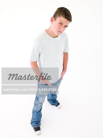 Teenage boy standing with hands in pockets