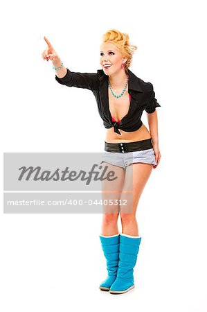 Full length portrait of cheerful modern girl pointing finger at copy space isolated on white