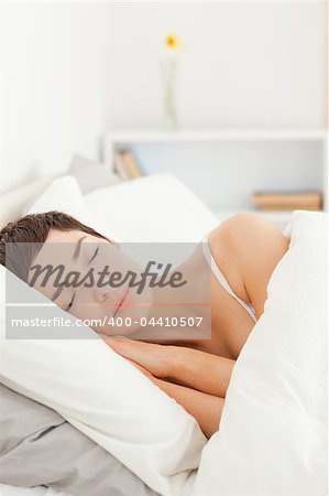 Portrait of a charming woman sleeping in her bedroom