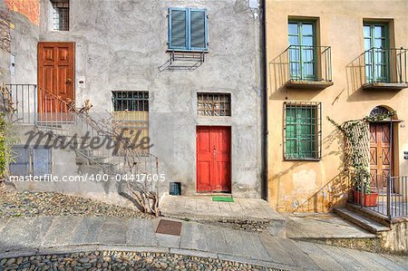 Wooden multicolored doors in the old house at the town of Saluzzo, northern Italy.