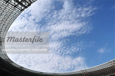 View on clouds through stadium roof. The Donbass Arena (Donetsk, Ukraine) is the first stadium in Eastern Europe designed and built to UEFA elite standards. Arena for semifinals Euro-2012.