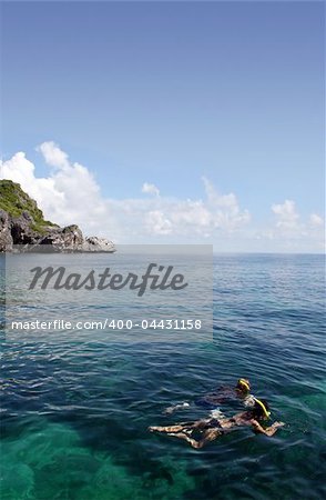 Two young people snorkelling in Ang Thong Marine Park in Thailand.