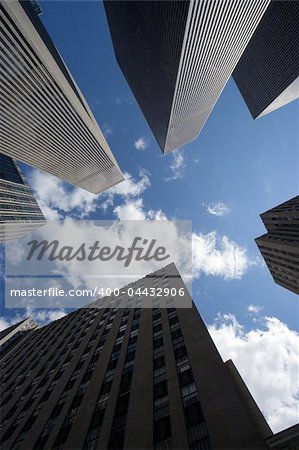 Modern skyscrapers against a bright blue sky