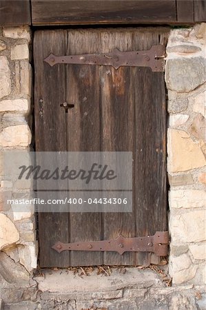 Old wooden door in stonewall