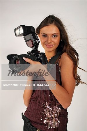 Girl - photographer with pro camera in hands