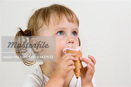 young girl eating tasty ice cream