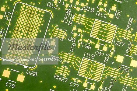 a close up of green circuit plate