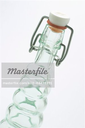 Glass Bottle with Cork on white seamless background