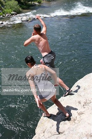 Cliff jumping into a mountain river in Montana