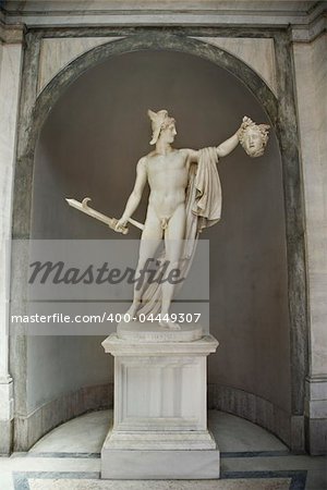 Sculpture of Perseus holding  head of the Gorgon Medusa in Vatican Museum in Rome Italy.