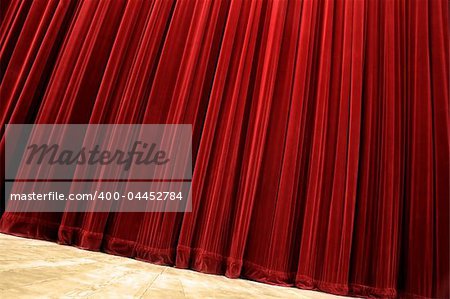 red velvet closed curtain, tilted photo, wooden floor