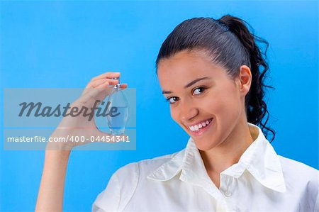 young pretty girl holding perfume