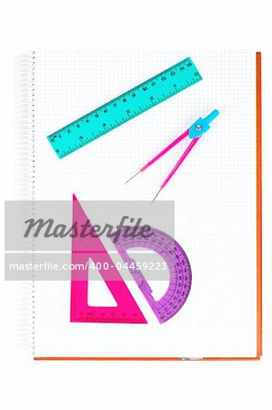 School supplies on a notebook, over white background