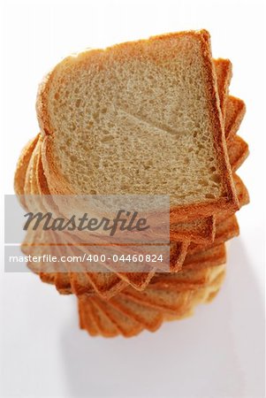 Spiral tower from toast bread slices with visible bread texture