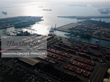 Aerial view of dock with cargo containers for shipping in Los Angeles, California.