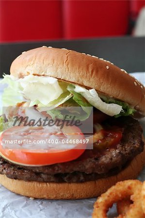 Fastfood hamburger bun on paper wrapper