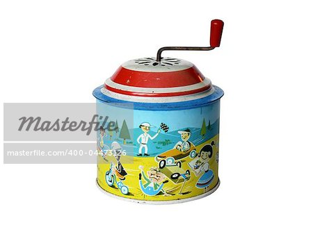 old tin toy musical box showing a cartoon racing-car scene, on white ground old tin toy musical box showing a cartoon racing-car scene, on white ground