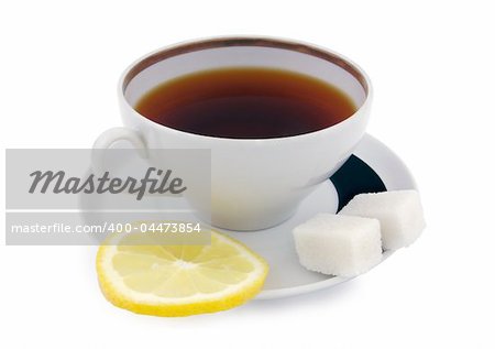 A cup of tea with sugar cubes and lemon slice. Clipping path included.