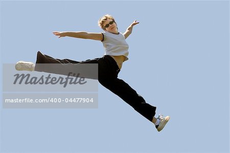 Young woman jumping high