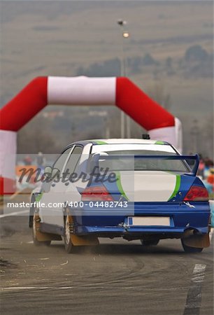 Rally car during the race in a curve.