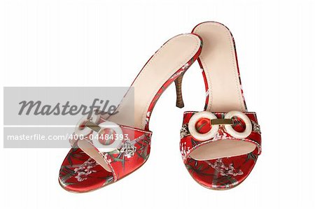 Red shoes with an ornament on a white background