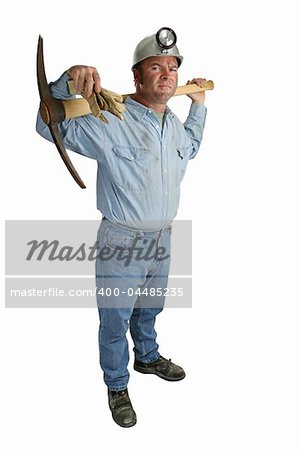 A full view of a coal miner holding a pickax on his shoulders - isolated.