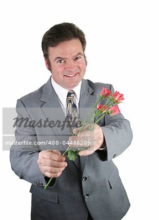 A husband apologizing to his wife by offering her pink roses.