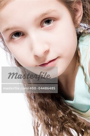 Studio portrait of a young girl looking concentrated