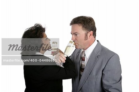 A man and a woman toasting eachother with champagne.  Could be either a romantic couple or business partners.
