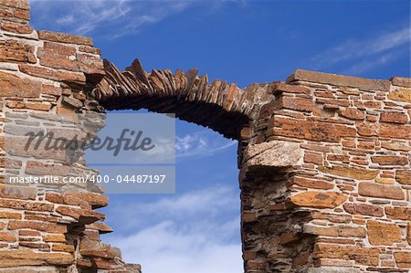 Detail of window arch weathered to a line of stones
