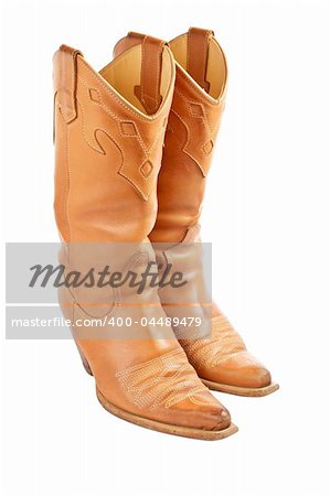 A pair of used cowboy boots isolated on white background