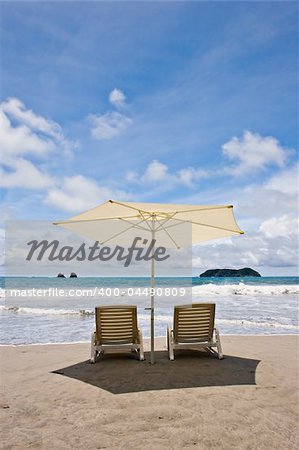 Two chairs and umbrella at the beach. Manuel Antonio, Costa Rica.