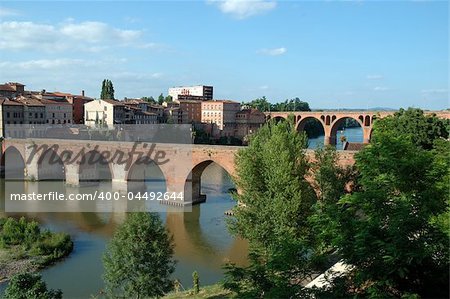 The river Tarn in Albi in the south west of France is crossed by the "Pont-vieux" (old bridge) in the foreground and the "Pont du 22 aôut 1944" (August 22nd, 1944 bridge)  in the background.