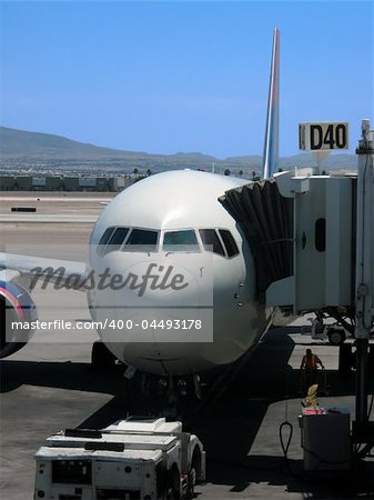 Airplane parked at gate at McCarran International Airport in Las Vegas, Nevada.