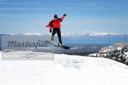 Snowboarder enjoying a view at Lake Tahoe, California