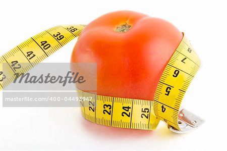 A tomato wrapped in a tape measure
