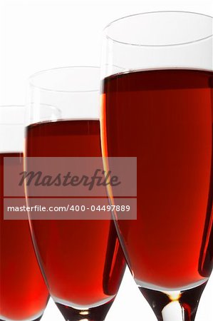 Three glasses with red wine on a white background