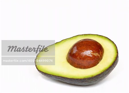 half of an avocado with pit remaining